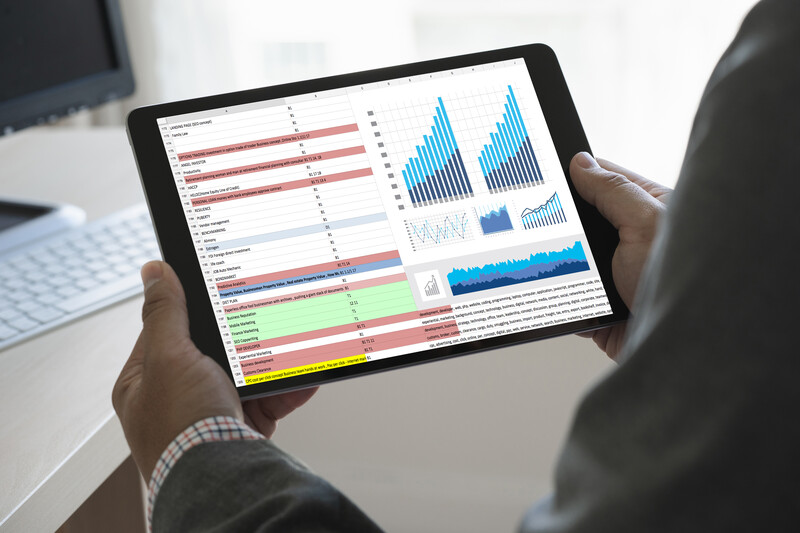 tablet with web analytics charts and graphs on it